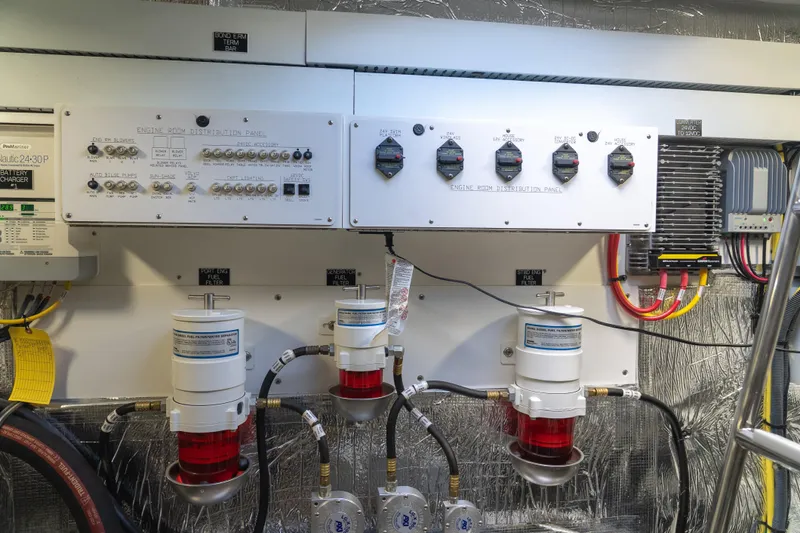 Duke Yacht Photos Pics Engine room of 2018 Cruisers Yachts 50 Cantius with control panels and fuel filters.