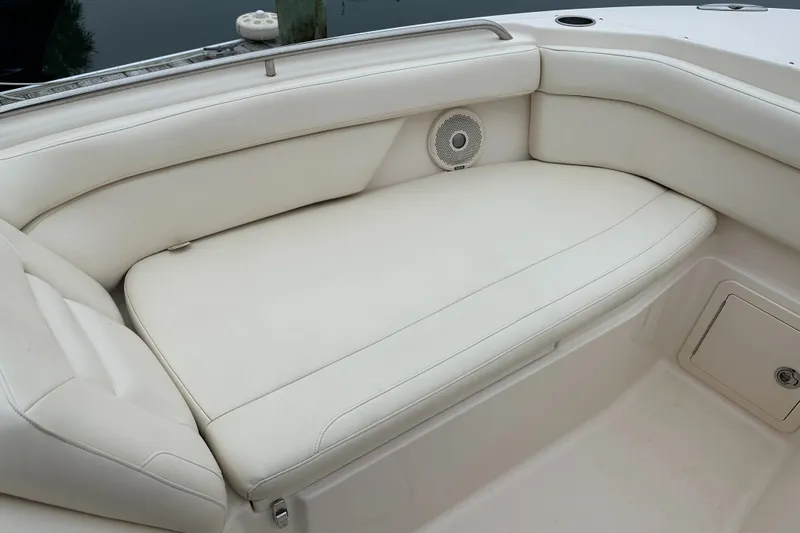  Yacht Photos Pics 2018 Grady-White Freedom 285 boat interior with white cushioned seating.