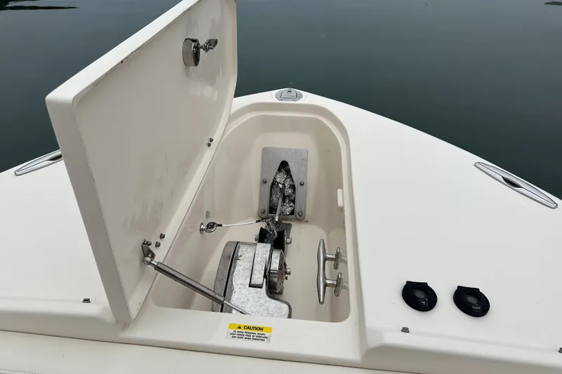  Yacht Photos Pics 2018 Grady-White Freedom 285 anchor compartment with open hatch on calm water.