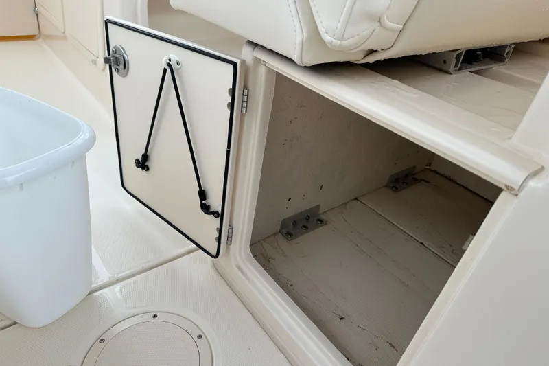  Yacht Photos Pics Open storage compartment on a 2018 Grady-White Freedom 285 boat interior.