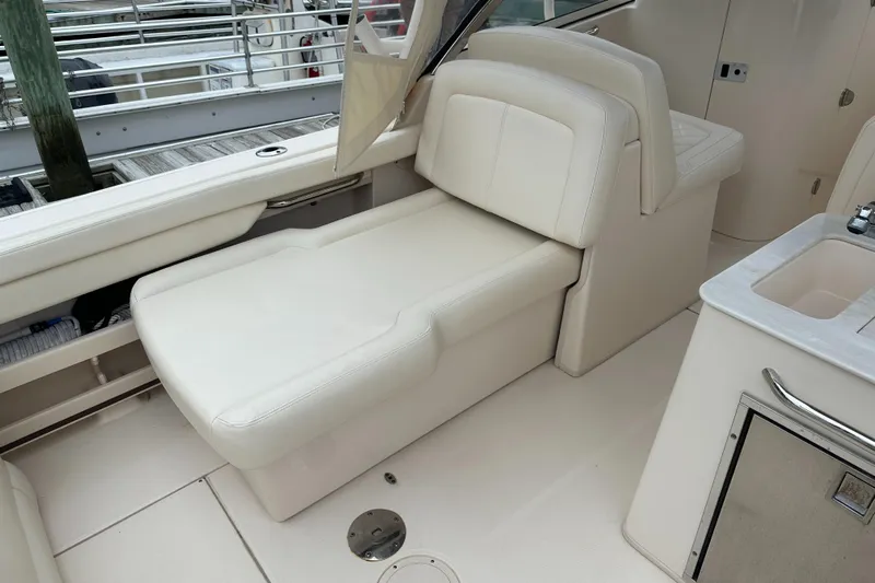 Yacht Photos Pics 2018 Grady-White Freedom 285 boat interior with white cushioned seating.