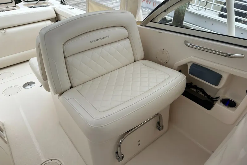  Yacht Photos Pics 2018 Grady-White Freedom 285 boat interior with white cushioned seating.