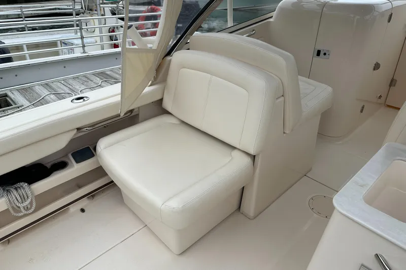  Yacht Photos Pics 2018 Grady-White Freedom 285 boat interior with white leather seating.