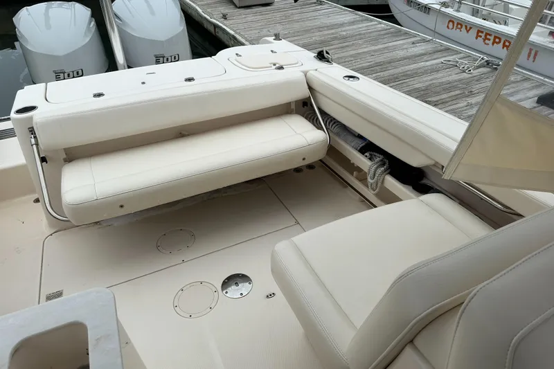  Yacht Photos Pics 2018 Grady-White Freedom 285 boat interior with seating and dock view.