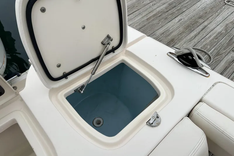  Yacht Photos Pics Open storage compartment on 2018 Grady-White Freedom 285 boat, dockside view.