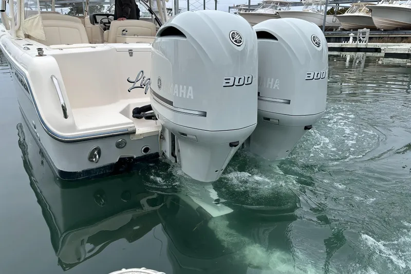  Yacht Photos Pics 2018 Grady-White Freedom 285 boat with twin Yamaha 300 engines in calm water.