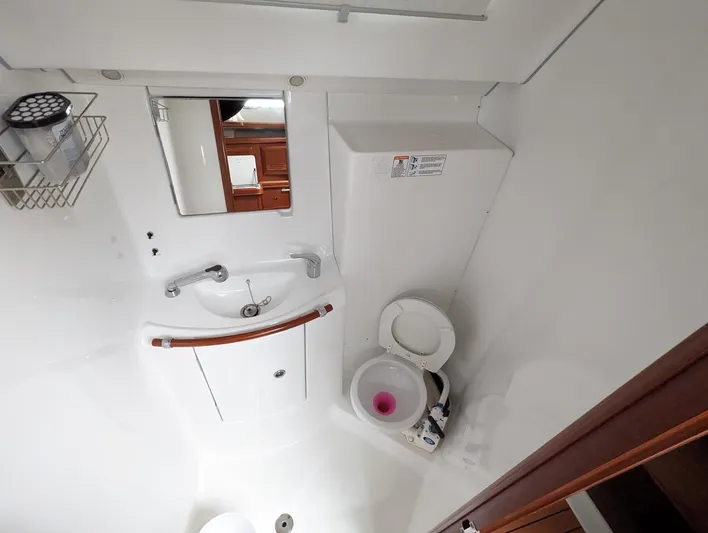  Yacht Photos Pics Bathroom interior of 2005 Beneteau 393 yacht with sink and toilet.