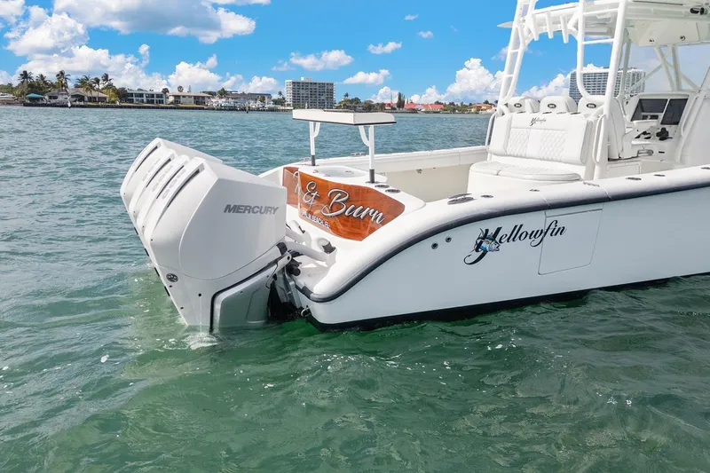  Yacht Photos Pics 2015 Yellowfin 39 Offshore boat with Mercury engines on clear water.