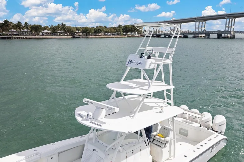 Yacht Photos Pics 2015 Yellowfin 39 Offshore boat on water near a bridge, clear sky.