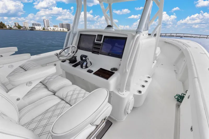  Yacht Photos Pics 2015 Yellowfin 39 Offshore boat interior with modern navigation system and luxurious seating.