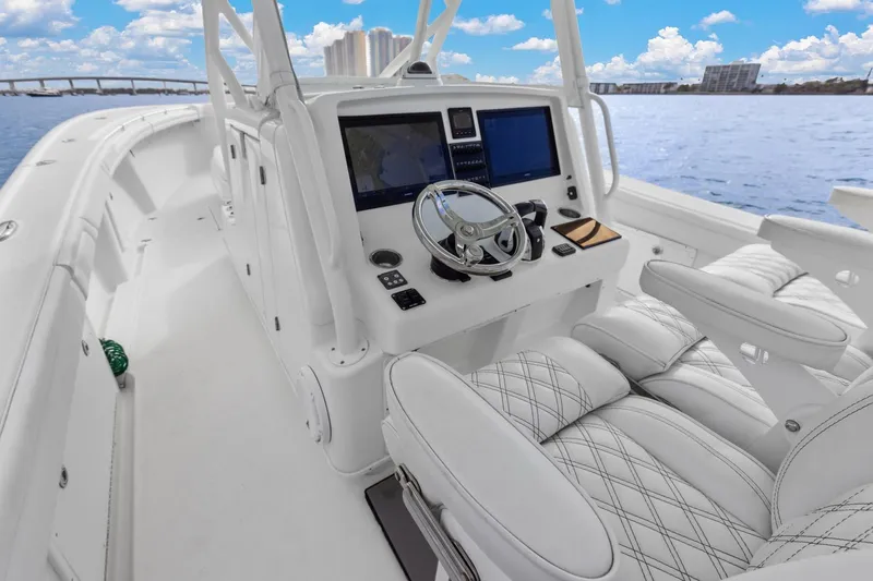  Yacht Photos Pics 2015 Yellowfin 39 Offshore boat interior with modern helm and luxurious seating.