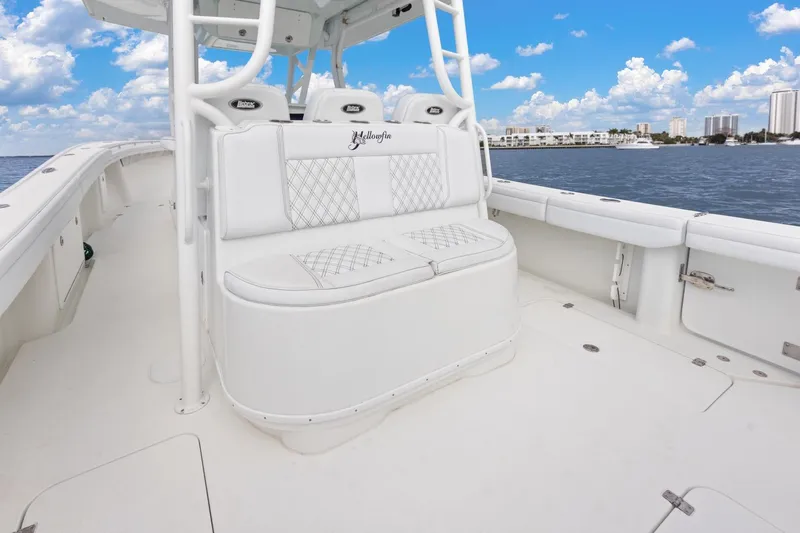  Yacht Photos Pics 2015 Yellowfin 39 Offshore boat interior with white seating, ocean view, and blue sky.