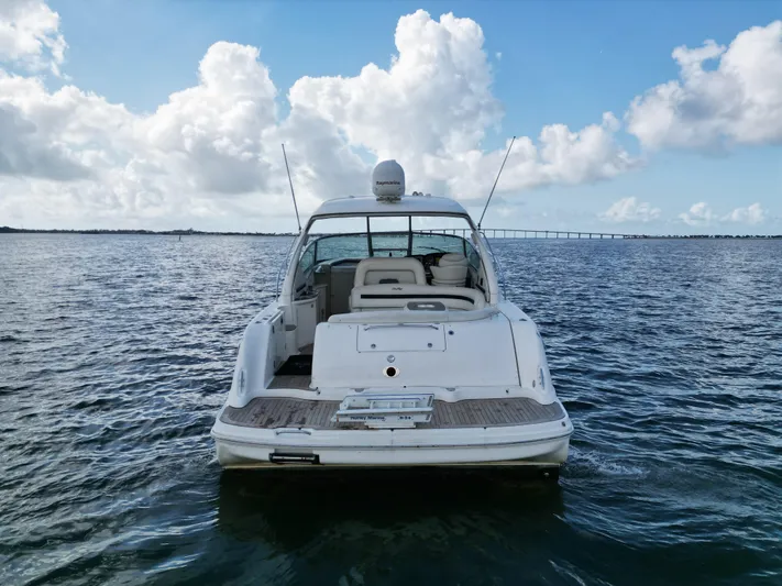  Yacht Photos Pics 2005 Sea Ray 44 Sundancer yacht on open water under a blue sky.