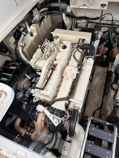  Yacht Photos Pics Engine compartment of a 2005 Sea Ray 44 Sundancer boat, showcasing detailed machinery.