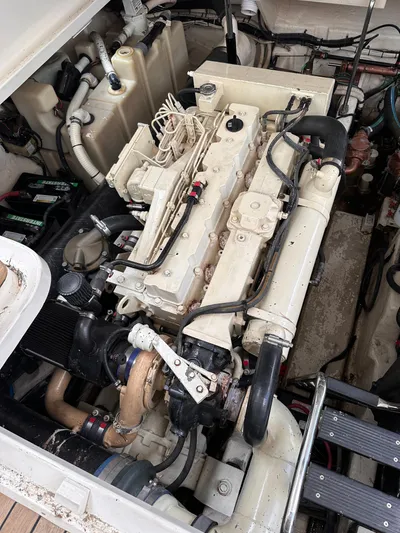  Yacht Photos Pics Engine compartment of a 2005 Sea Ray 44 Sundancer boat, showcasing detailed machinery.
