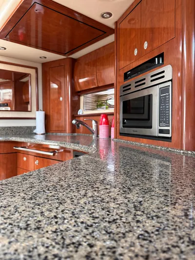  Yacht Photos Pics Luxurious kitchen interior of 2005 Sea Ray 44 Sundancer yacht with granite countertops.