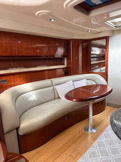  Yacht Photos Pics Luxurious interior of 2005 Sea Ray 44 Sundancer yacht with elegant seating and wooden finishes.