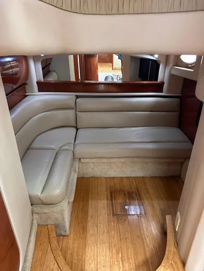  Yacht Photos Pics Interior of 2005 Sea Ray 44 Sundancer with beige leather seating and wooden flooring.