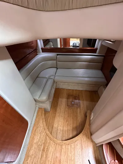  Yacht Photos Pics Interior of 2005 Sea Ray 44 Sundancer with leather seating and wooden flooring.