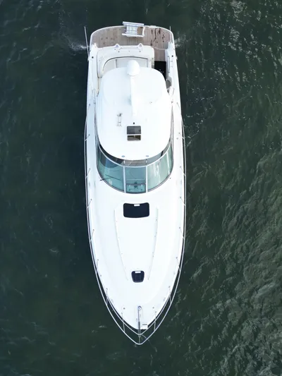  Yacht Photos Pics Aerial view of 2005 Sea Ray 44 Sundancer yacht cruising on water.