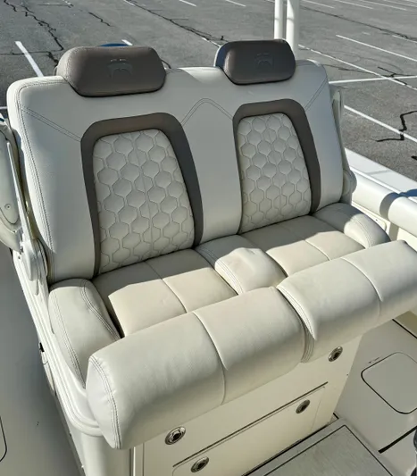 Reelaxing Yacht Photos Pics Luxurious seating on a 2017 World Cat 295 CC boat, featuring stylish upholstery and headrests.
