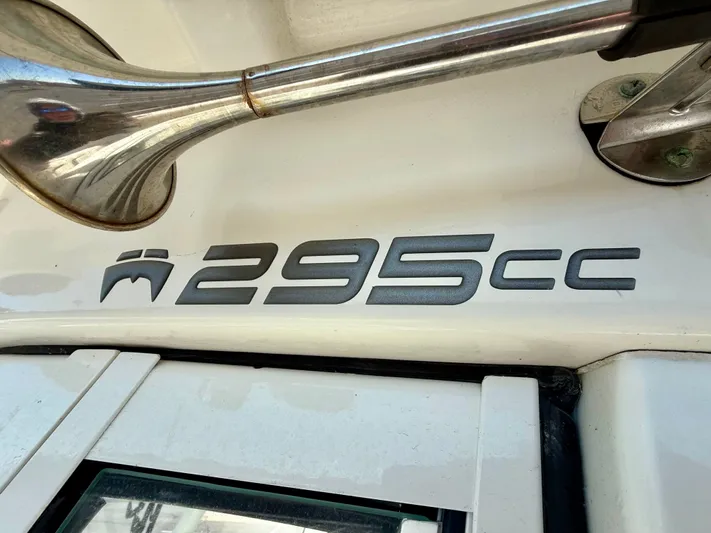 Reelaxing Yacht Photos Pics Close-up of 2017 World Cat 295 CC boat model emblem and horn.
