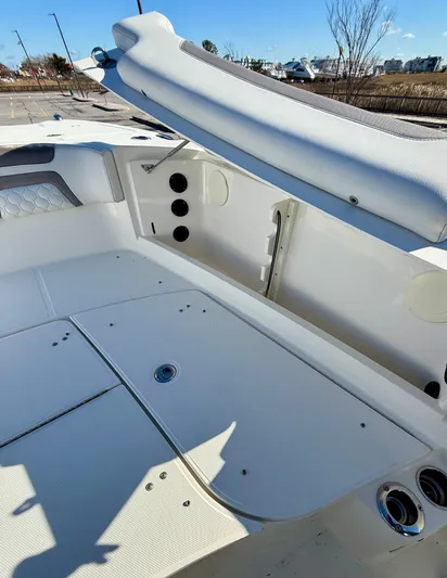 Reelaxing Yacht Photos Pics 2017 World Cat 295 CC boat interior with open storage compartment and seating.