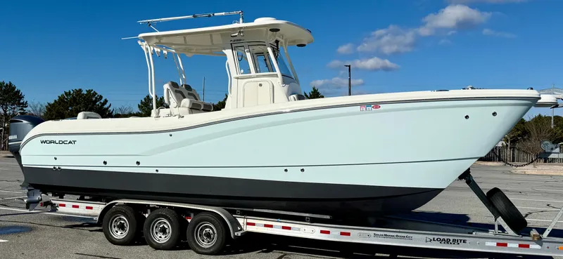Reelaxing Yacht Photos Pics 2017 World Cat 295 CC boat on trailer under clear blue sky.