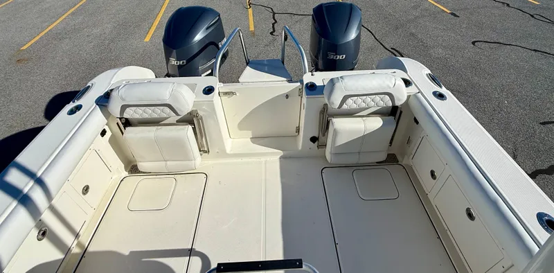 Reelaxing Yacht Photos Pics 2017 World Cat 295 CC boat interior with twin 300 engines, spacious seating, and storage compartments.