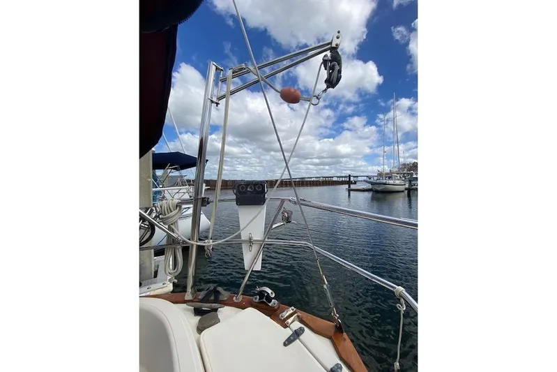 Irish Rose Yacht Photos Pics Sailboat deck view, Pacific Seacraft Crealock 34, 1995, with marina and cloudy sky.