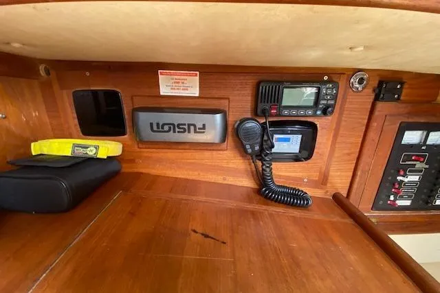 Irish Rose Yacht Photos Pics Navigation equipment inside a 1995 Pacific Seacraft Crealock 34 sailboat cabin.