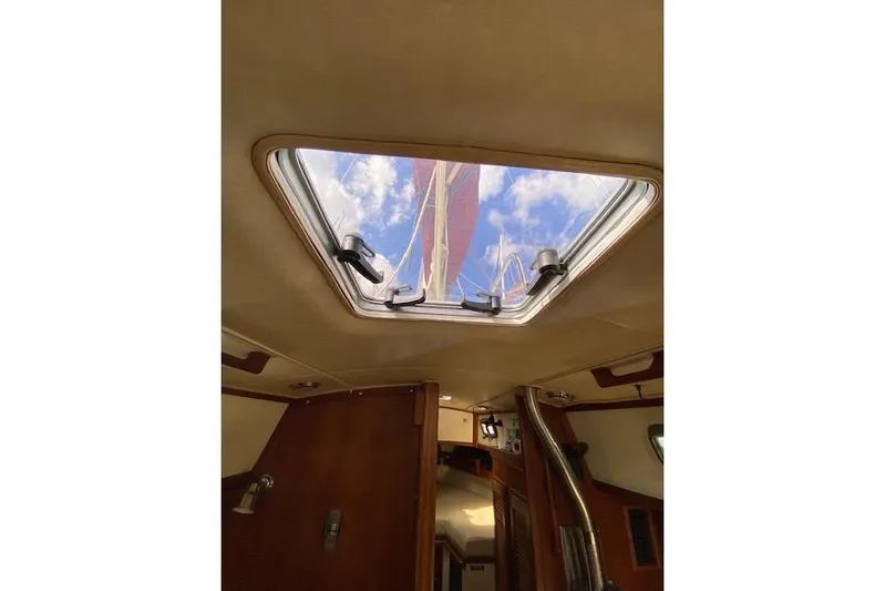 Irish Rose Yacht Photos Pics Interior view of 1995 Pacific Seacraft Crealock 34 sailboat, looking through hatch at sky.