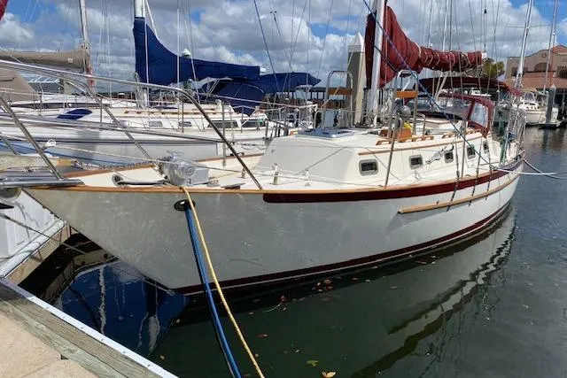 Irish Rose Yacht Photos Pics Sailboat docked in marina, 1995 Pacific Seacraft Crealock 34, clear skies above.