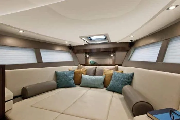 On Sebbatical Yacht Photos Pics Luxurious interior of 2018 Monterey 360 Sport Coupe with plush seating and elegant decor.