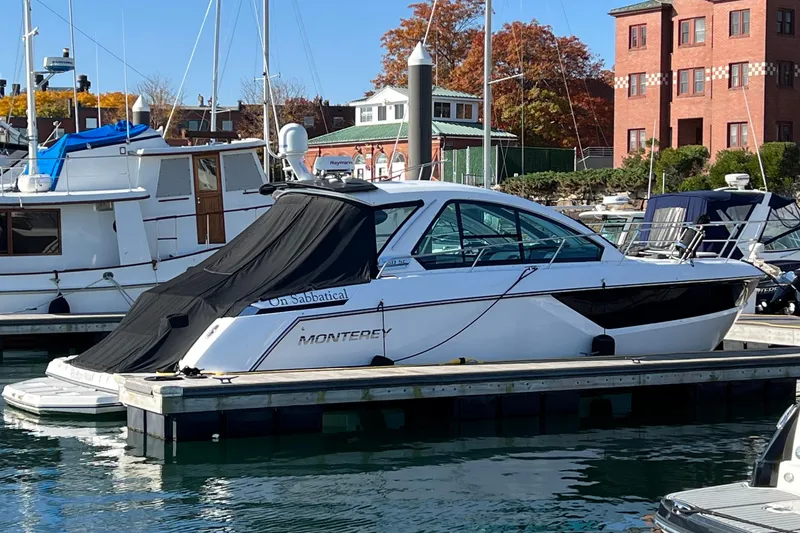 On Sebbatical Yacht Photos Pics 2018 Monterey 360 Sport Coupe docked at marina with autumn foliage background.