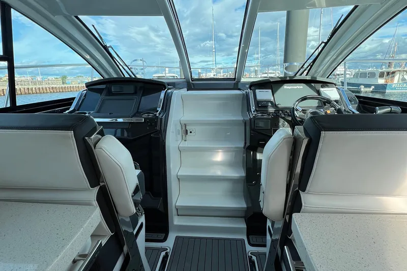 On Sebbatical Yacht Photos Pics Interior view of 2018 Monterey 360 Sport Coupe yacht cockpit with modern controls and seating.