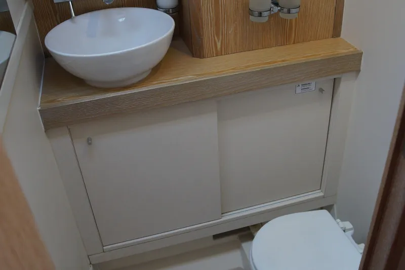  Yacht Photos Pics Bathroom interior of 2013 Hanse 575 yacht with sink and toilet.