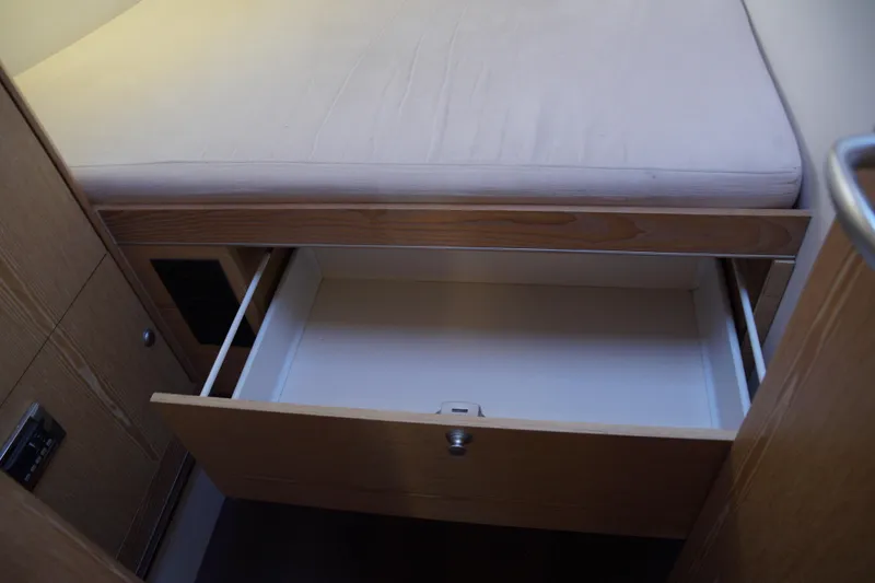  Yacht Photos Pics Open drawer under bed in 2013 Hanse 575 yacht cabin interior.