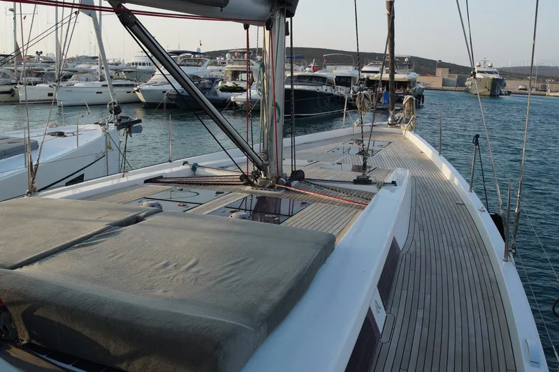  Yacht Photos Pics Luxury Hanse 575 yacht from 2013 docked in a marina, showcasing sleek deck design.