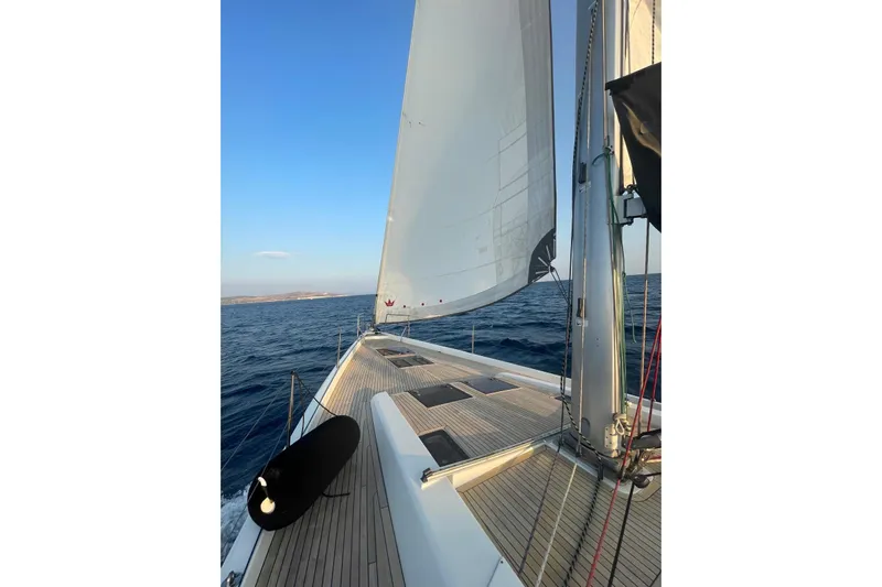  Yacht Photos Pics Sailing on a 2013 Hanse 575 yacht with clear blue skies and calm sea.