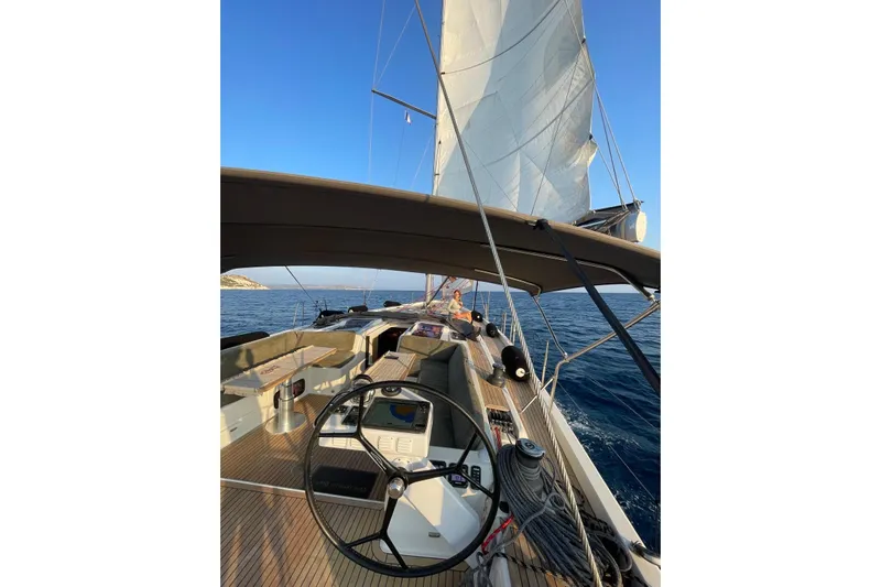  Yacht Photos Pics Sailing on a 2013 Hanse 575 yacht with open sails and clear blue skies.