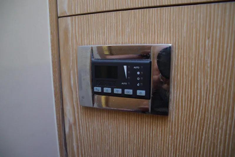  Yacht Photos Pics Control panel on a 2013 Hanse 575 yacht's wooden interior.