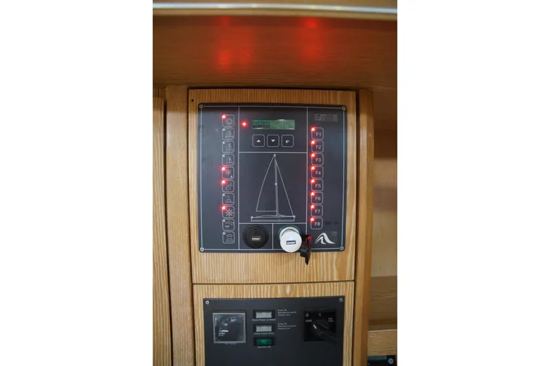  Yacht Photos Pics Control panel of a 2013 Hanse 575 yacht, featuring illuminated buttons and switches.