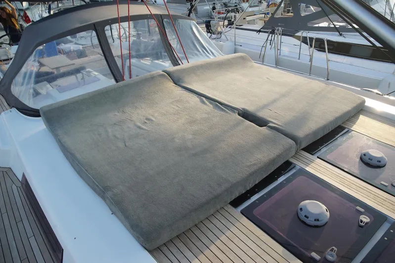  Yacht Photos Pics Sunbathing area on 2013 Hanse 575 yacht with cushioned deck and sleek design.