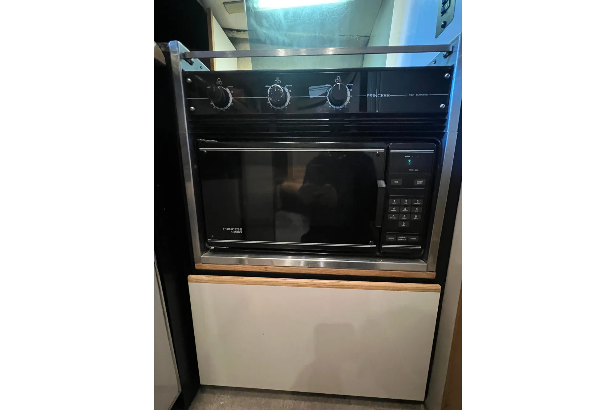 Built-in microwave oven in 1989 Bayliner 4285 Avanti yacht kitchen.