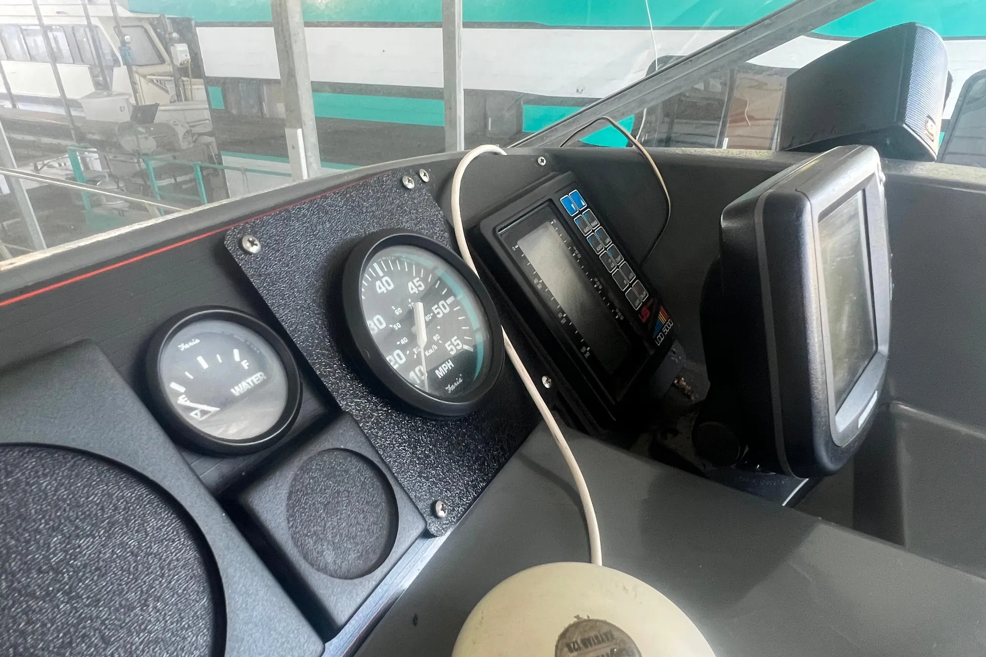 Dashboard of a 1989 Bayliner 4285 Avanti boat with gauges and controls.