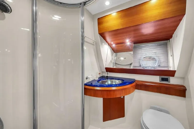  Yacht Photos Pics Luxurious bathroom interior of 2006 Azimut 50 Fly yacht with modern fixtures.