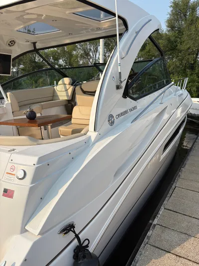 Jac & Wood Yacht Photos Pics 2017 Cruisers Yachts 380 Express, sleek white design, docked with luxurious seating area.