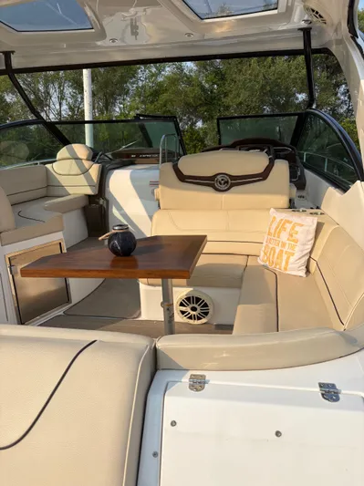 Jac & Wood Yacht Photos Pics Luxurious interior of 2017 Cruisers Yachts 380 Express with beige seating and wooden table.