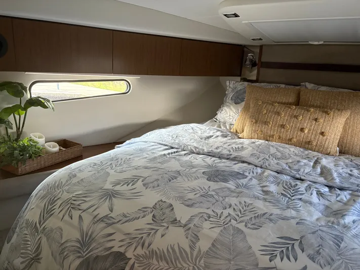 Jac & Wood Yacht Photos Pics Luxurious cabin interior of 2017 Cruisers Yachts 380 Express with elegant bedding and decor.